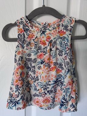 Girls floral blouse with orange and blue pattern